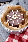 Star shaped almond cake in greaseproof paper