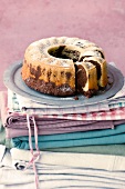 Marble cake on plate on stack of clothes
