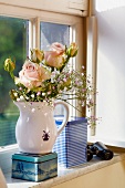Milk jug as vase, cookie jars, roses, flowers on window sill