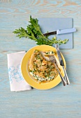 Plate of pancakes with turnip leaves on chopping board