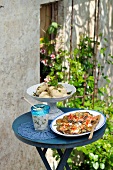 Eggplant with cauliflower salad and thyme leaves on table