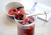 Close-up of summer compote on spoon