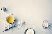 Various ingredients and whisk on white background