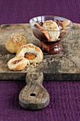 Cheese dumplings with stewed fruit in glass and plum dumplings on chopping board