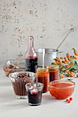 Elderberry and rose hips syrup in jars and bottles