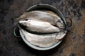 Three trout fish in wok