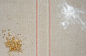 Grains and flour on gray background