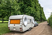 Caravans and car parked in Royal Gardens, Herrenhausen Palace, Hannover, Germany