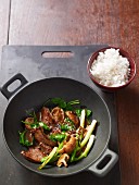 Stir-fried beef with shiitake mushrooms, spinach and sesame seeds