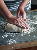 Close-up of kneading dough, step 1