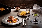 Veal steak and mushroom crust on plate with tableware