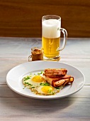 Slices of stuffed meat loaf with crispy bread crust and eggs on plate, Bavaria, Germany