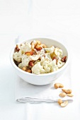 Cauliflower & date salad with cashew nuts in bowl