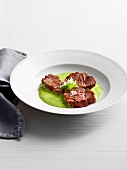 Ox cheeks with cress in serving dish, Bavaria, Germany