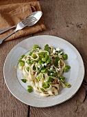 Pasta with broad beans and mint on plate