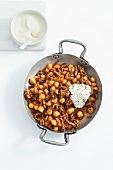 White chickpea curry in wok 