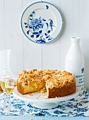 Apple crumble cake served with apple brandy
