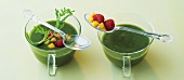 Green drink in glass and spoon with berries