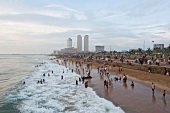 People at Galle Face Green with World Trade Centre in background, Colombo, Sri Lanka