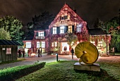 View of people at illuminated Haus am Waldsee in Zehlendorf, Berlin, Germany