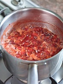 Close-up of marmalade being cooked in pan for preparation of jam
