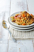 Plate of chicken pilaf on stacked plates