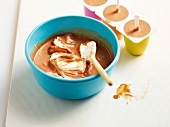Chocolate ice cream in mould cups and bowl