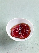Red current jelly with raspberries in bowl