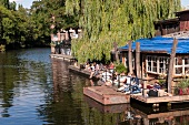 People relaxing at Club der Visionaere, Treptow, Berlin, Germany