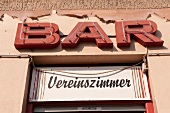 Close-up of name of bar Club Room Lo Spazio in Kreuzberg, Berlin, Germany