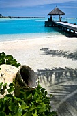 View of jetty with blue sea near Veligandu Huraa resort, Maldives