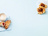 Marzipan croissants and plum-quark on white background