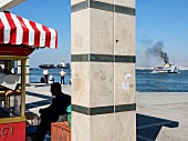 View of ferry in sea and shop on promenade, Izmir, Aegean Region, Turkey