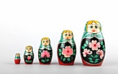 Colourful Russian dolls on white background