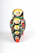 Colourful Russian dolls on white background