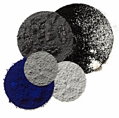 Different shades of eye shadow, gray, anthracite, black and blue on white background