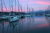 View of boats at harbour of Fethiye at night in Aegean, Turkey