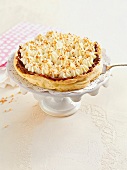 Close-up of plum crunchy cake on cake stand