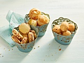 Crispy cereal balls in cupcake cases on white background