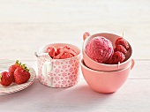 Strawberry and raspberry ice cream in cups