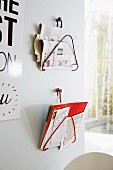 Metal coathangers wrapped in ribbons and upcycled into magazine racks