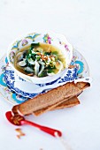 Spinach soup with fennel, feta and pine nuts