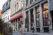 People walking on street outside shops in Rue Saint-Paul Street, Montreal, Canada