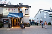 People walking around Salty's shop, Halifax, Nova Scotia, Canada