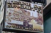 Close-up of shield of Restaurant L'Usine de Spaghetti, Montreal, Canada