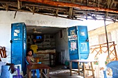 Woman sitting at a shop in Zanzibar, Tanzania, East Africa