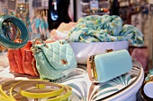 Colourful handbags, scarves and cases
