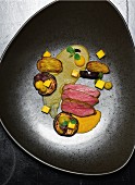 Lamb with curry sauce, aubergines and mango