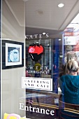 Kate's Catering and Cafe logo on glass at the entrance, Lunenburg, Nova Scotia, Canada