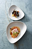 Cod with mussels, ravioli and tomato-pepper on serving dish